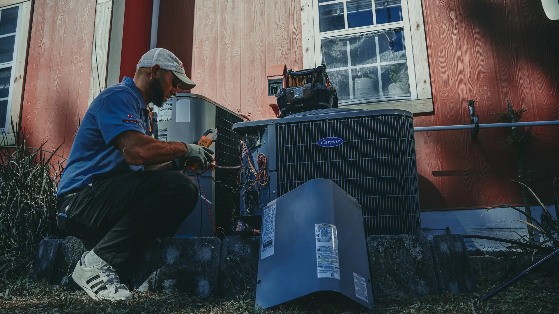 Einstein technician servicing an outdoor AC unit in Jacksonville, FL