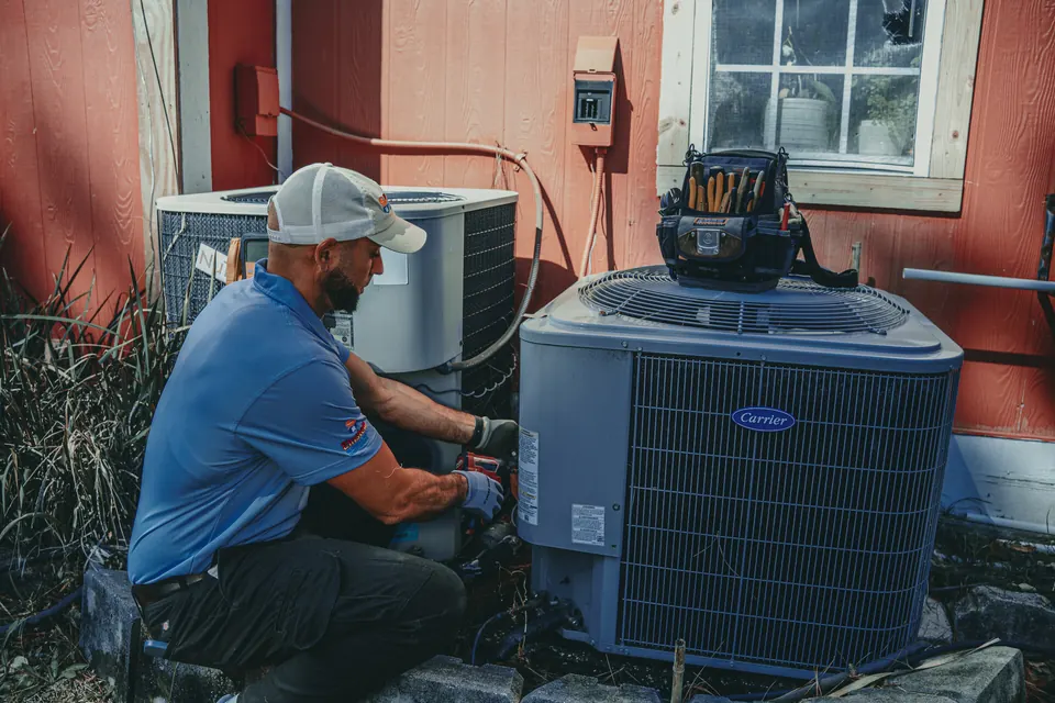 Einstein technician servicing an outdoor AC unit in Jacksonville, FL