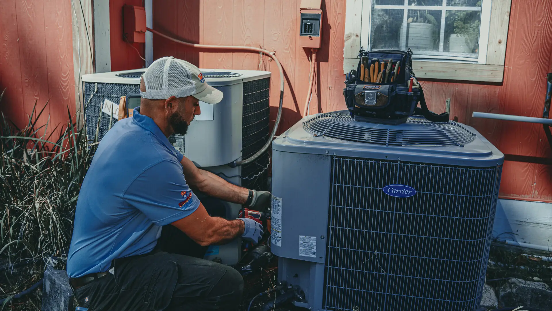 Einstein technician repairing an air conditioner in Jacksonville, FL