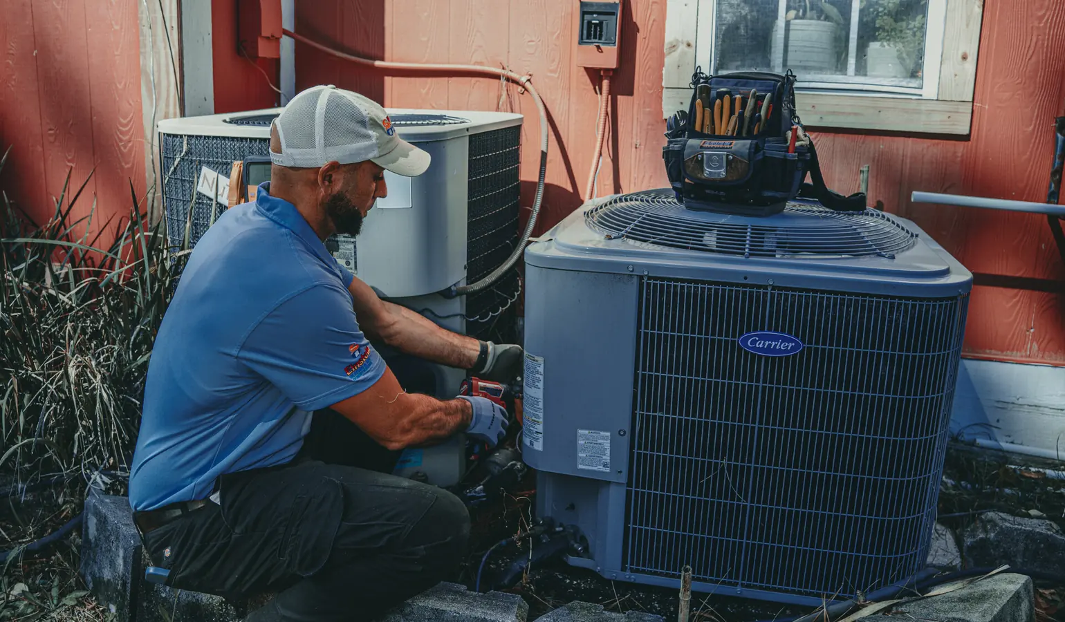 Einstein technician servicing an outdoor heat pump in Jacksonville, FL